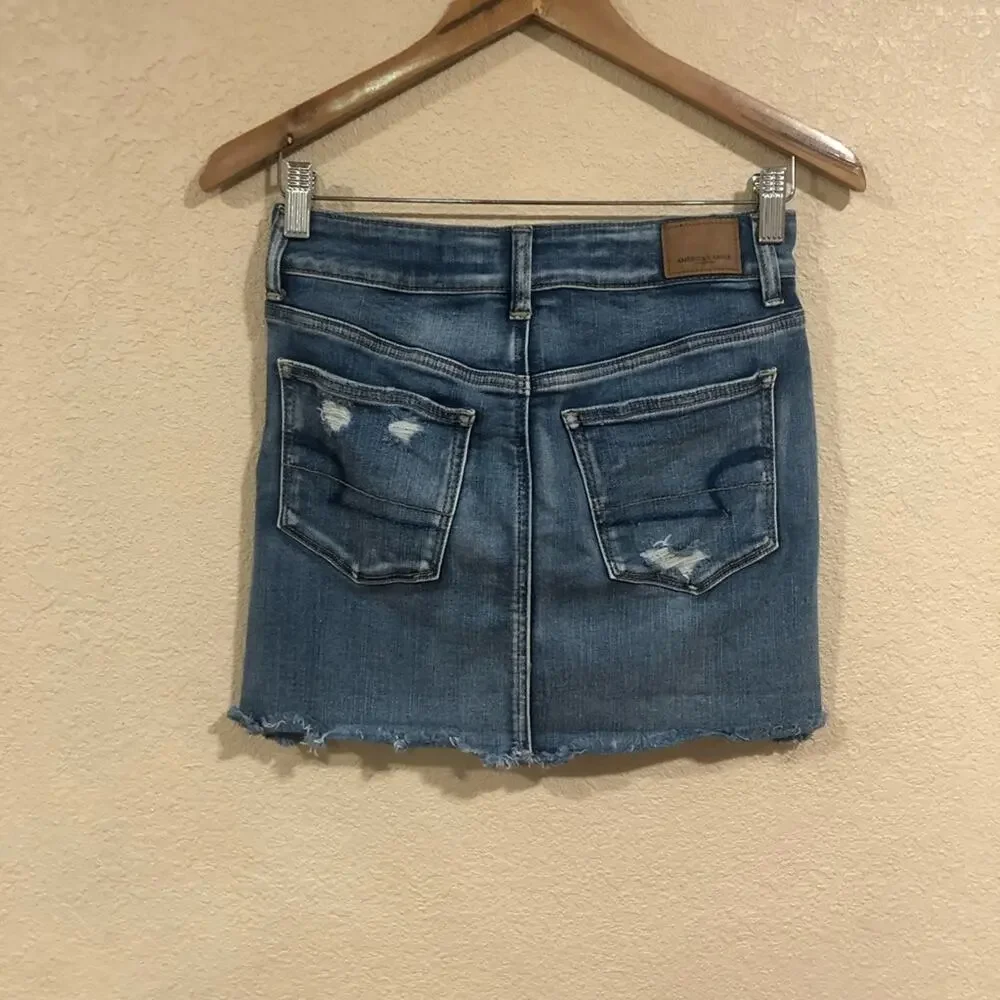 American Eagle Outfitters AEO distressed medium blue wash high rise mini skirt
